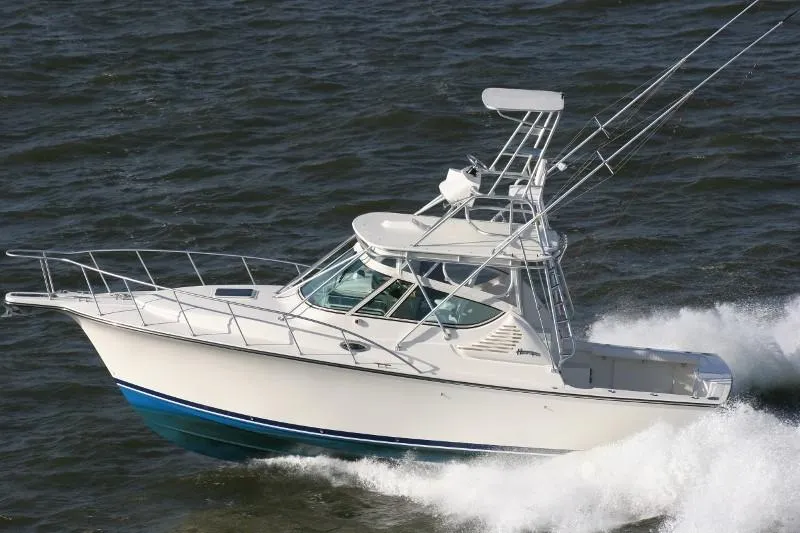 Slide: The Image of 2025 Henriques 30' Express boat cruising on the water. - 5