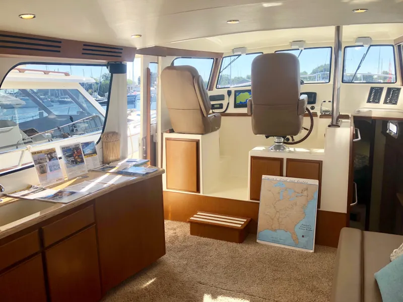 Slide: The Image of Interior of 2025 Henriques 42 Cruiser yacht with helm station and navigation equipment. - 11