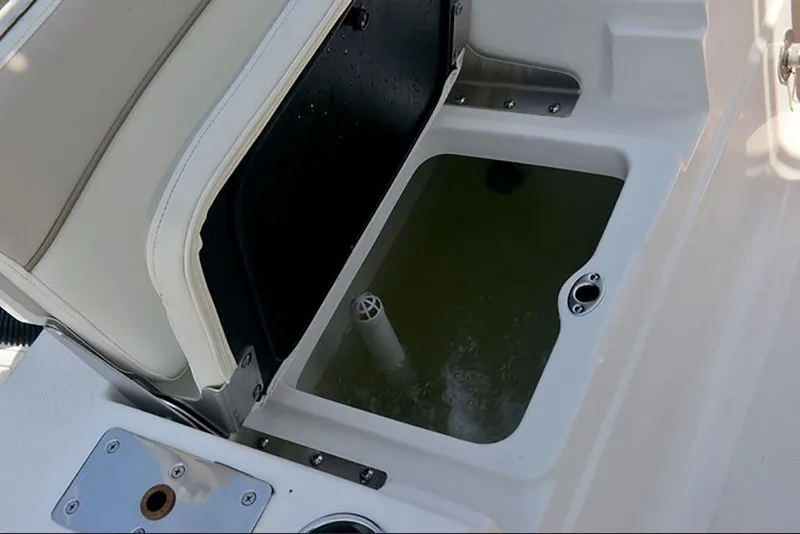 Slide: The Image of 2023 NauticStar 227 XTS livewell with open lid and water inside. - 12