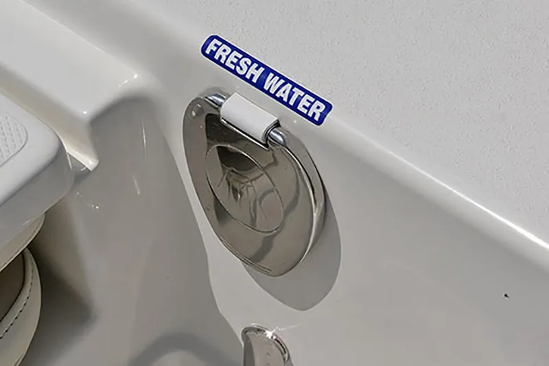 Slide: The Image of 2023 NauticStar 227 XTS fresh water fill port. - 16