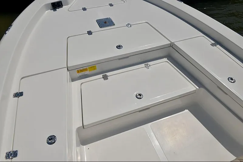 Slide: The Image of 2023 NauticStar 227 XTS boat deck with storage compartments. - 7