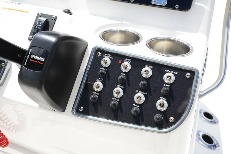 Slide: The Image of Control panel of 2023 NauticStar 215 XTS boat with Yamaha throttle and switches. - 14