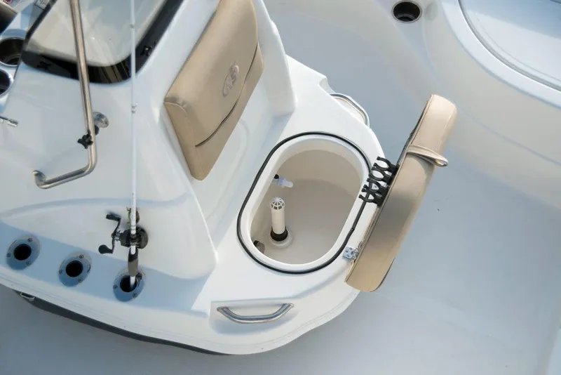 Slide: The Image of 2023 NauticStar 215 XTS boat interior with open storage compartment. - 21