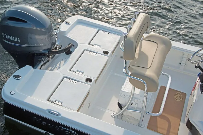 Slide: The Image of 2023 NauticStar 215 XTS boat with Yamaha outboard motor on water. - 9