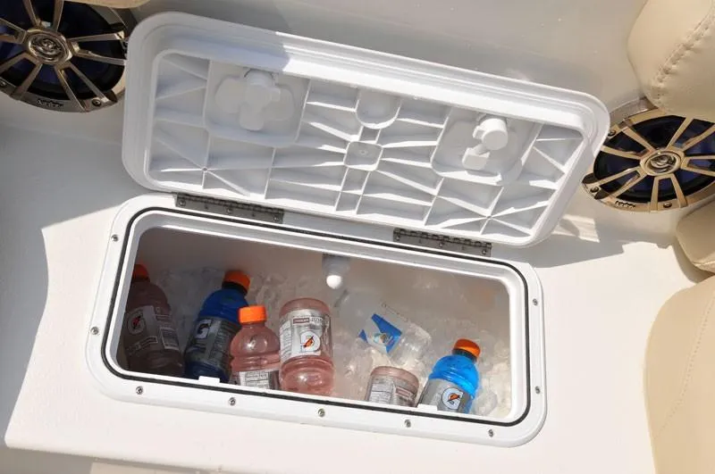 Slide: The Image of Built-in cooler with drinks on a 2023 NauticStar 223DC Sport Deck boat. - 12