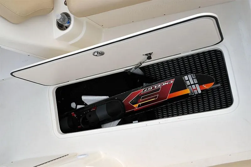 Slide: The Image of 2023 NauticStar 223DC Sport Deck storage compartment with water ski. - 17