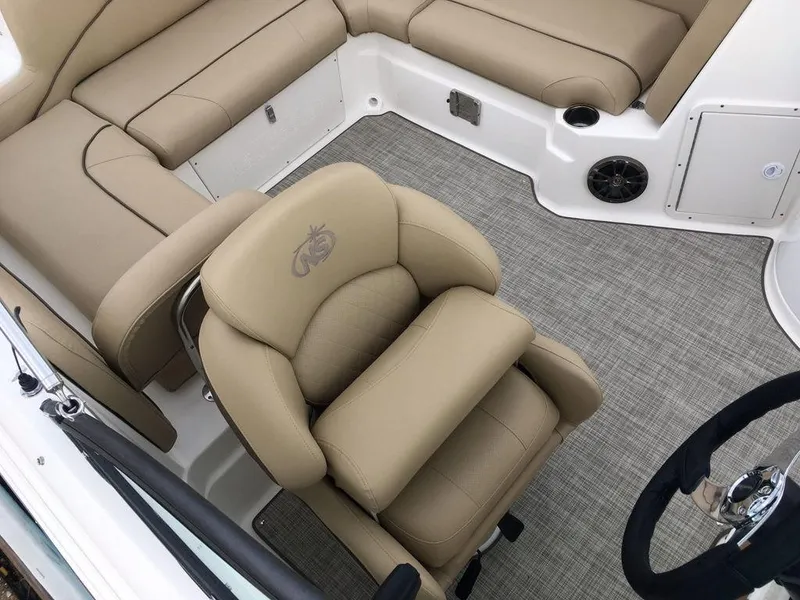 Slide: The Image of 2023 NauticStar 223DC Sport Deck boat interior with tan seating and gray flooring. - 21