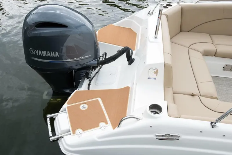 Slide: The Image of 2023 NauticStar 223DC Sport Deck boat with Yamaha outboard motor. - 23