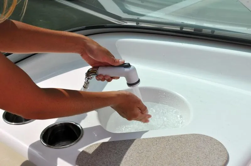 Slide: The Image of Hands using sink on 2023 NauticStar 203DC Sport Deck boat. - 12