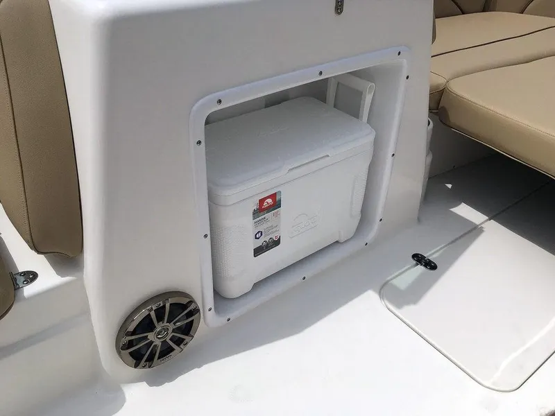 Slide: The Image of 2023 NauticStar 203DC Sport Deck with built-in cooler storage and speaker. - 8