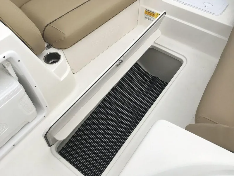 Slide: The Image of 2023 NauticStar 203SC Sport Deck boat interior storage compartment. - 11