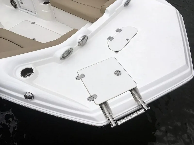 Slide: The Image of 2023 NauticStar 203SC Sport Deck boat bow with seating and ladder. - 12