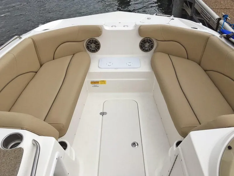 Slide: The Image of 2023 NauticStar 203SC Sport Deck boat interior with beige seating. - 7