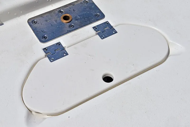 Slide: The Image of 2023 NauticStar 193 Side Console boat hatch with metal hinges and mounting plate. - 19