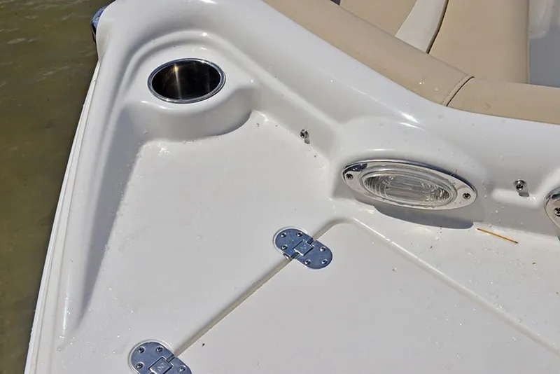 Slide: The Image of 2023 NauticStar 193 Side Console boat deck with cup holder and light. - 20