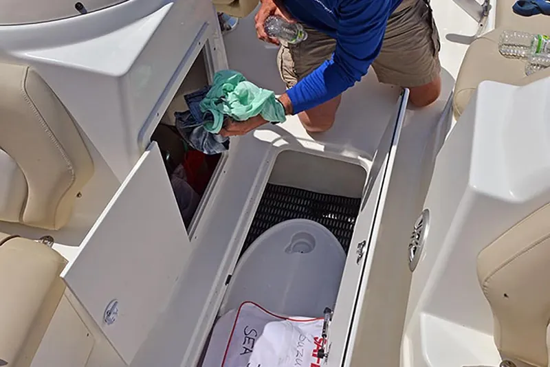 Slide: The Image of 2023 NauticStar 193 Side Console boat interior storage compartments. - 23