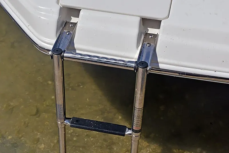 Slide: The Image of 2023 NauticStar 193 Side Console boat with a stainless steel swim ladder. - 24