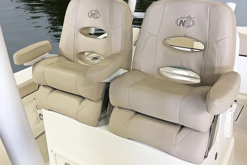 Slide: The Image of 2023 NauticStar 28 XS Offshore boat seats, beige leather, comfortable design. - 13