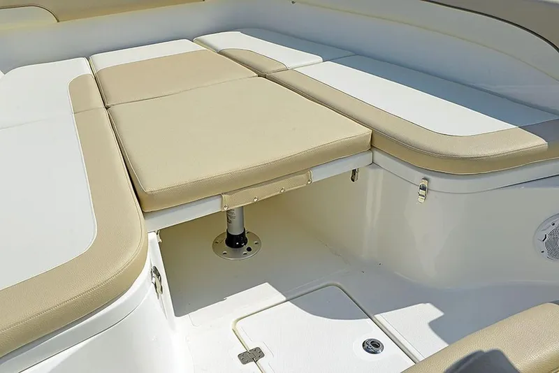 Slide: The Image of 2023 NauticStar 28 XS Offshore boat with cushioned seating area. - 16