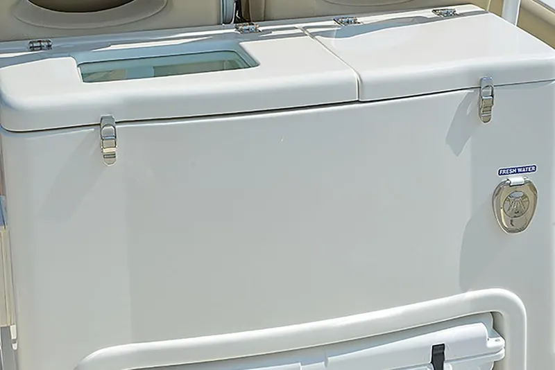 Slide: The Image of 2023 NauticStar 28 XS Offshore boat storage compartment with fresh water access. - 22