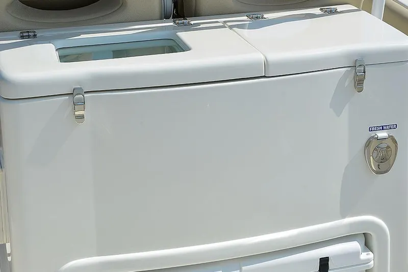 Slide: The Image of 2023 NauticStar 28 XS Offshore boat storage compartment with fresh water access. - 24