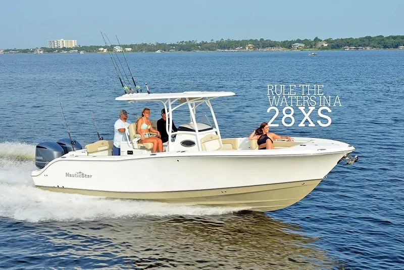 Slide: The Image of 2023 NauticStar 28 XS Offshore boat cruising on open water. - 3