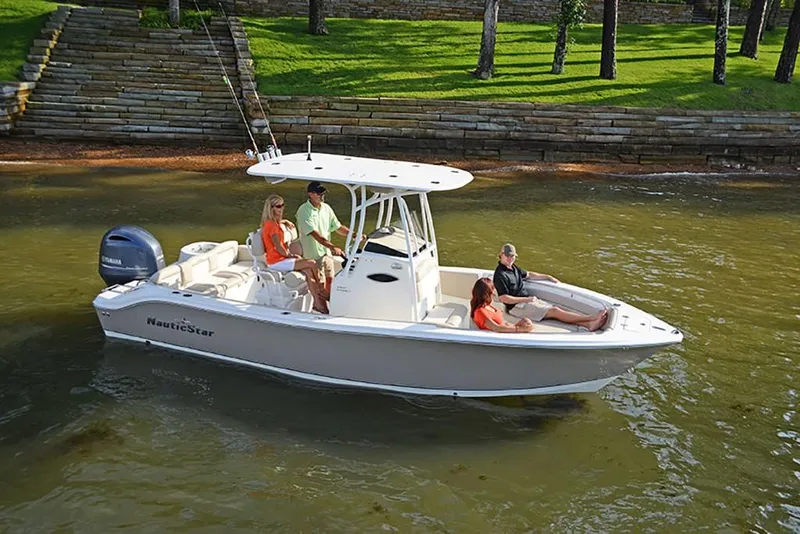 Slide: The Image of 2023 NauticStar 2302 Legacy boat with passengers on calm water. - 0