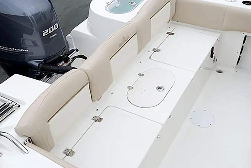 Slide: The Image of 2023 NauticStar 2302 Legacy boat interior with Yamaha 200 engine. - 25