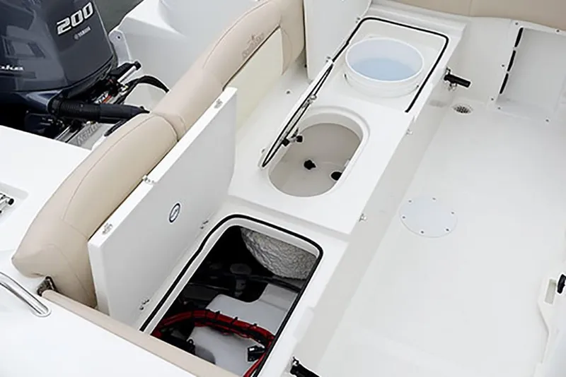 Slide: The Image of 2023 NauticStar 2302 Legacy boat interior with storage compartments and Yamaha 200 engine. - 26