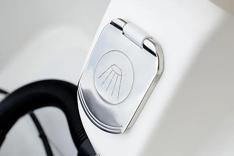 Slide: The Image of Close-up of a 2023 NauticStar 2302 Legacy boat shower head cover. - 27