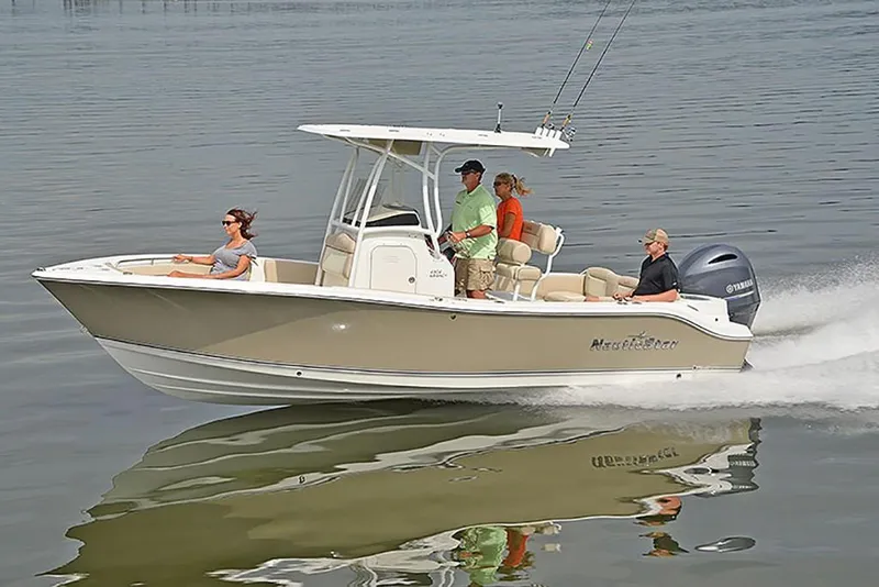 Slide: The Image of 2023 NauticStar 2302 Legacy boat cruising on calm water with passengers. - 3