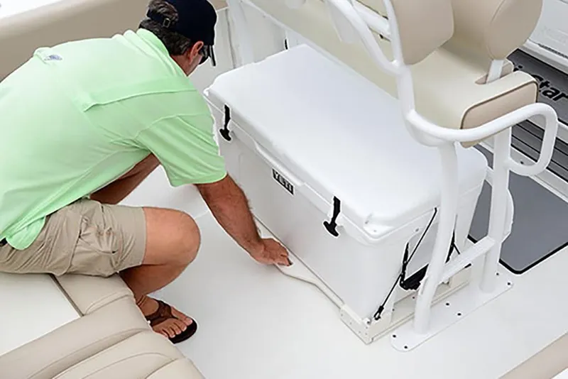 Slide: The Image of Man securing cooler on 2023 NauticStar 2302 Legacy boat. - 30