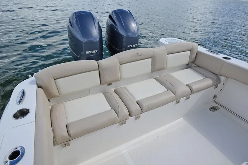Slide: The Image of 2023 NauticStar 2602 Legacy boat with twin 200 horsepower engines and comfortable seating. - 11