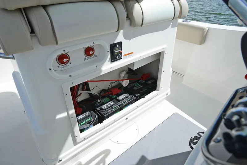 Slide: The Image of 2023 NauticStar 2602 Legacy boat battery compartment and electrical system. - 15