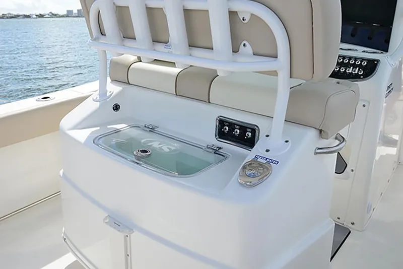 Slide: The Image of 2023 NauticStar 2602 Legacy boat interior with seating and control panel. - 28