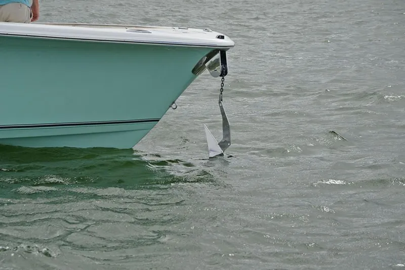 Slide: The Image of 2023 NauticStar 2602 Legacy boat with anchor in water. - 9