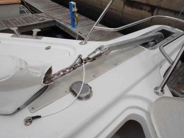 Slide: The Image of 2004 Riviera 58 Enclosed Flybridge anchor system at dock. - 14
