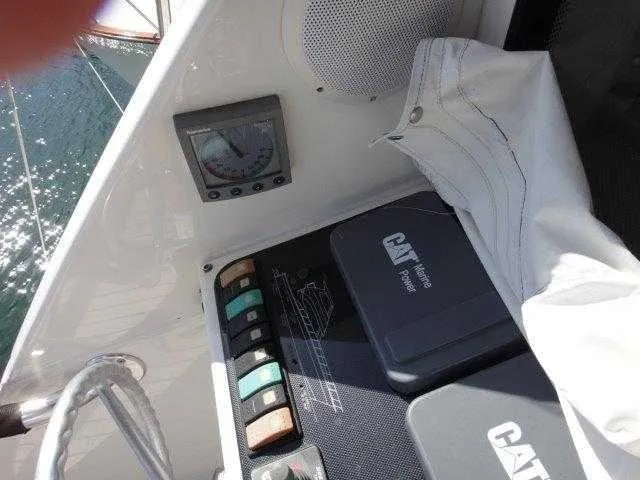 Slide: The Image of Control panel of 2004 Riviera 58 Enclosed Flybridge yacht with CAT engine system. - 22