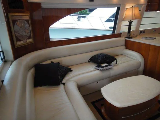 Slide: The Image of Luxurious interior of 2004 Riviera 58 Enclosed Flybridge with white leather seating. - 27