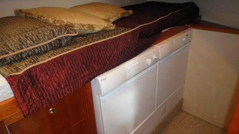 Slide: The Image of Laundry area in 2004 Riviera 58 Enclosed Flybridge yacht with washer and dryer. - 29