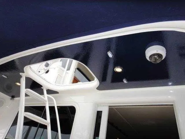 Slide: The Image of 2004 Riviera 58 Enclosed Flybridge yacht interior ceiling and ladder. - 40