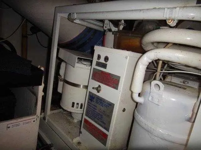 Slide: The Image of Engine room of 2004 Riviera 58 Enclosed Flybridge yacht with mechanical components. - 45
