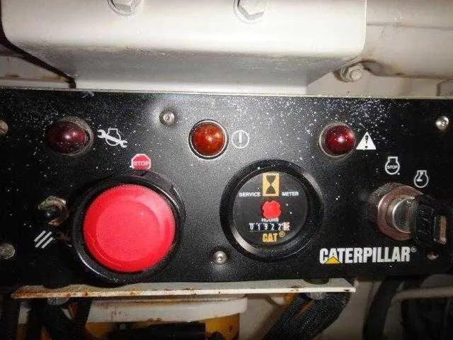 Slide: The Image of Control panel of a 2004 Riviera 58 Enclosed Flybridge with Caterpillar engine. - 48