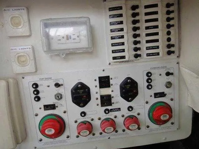 Slide: The Image of Control panel of a 2004 Riviera 58 Enclosed Flybridge yacht. - 49