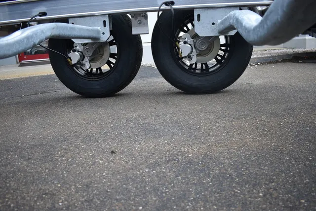 Slide: The Image of Yacht Club Trailers 21-6000 Aluminum tandem axle bunk boat trailer 2026 - 4