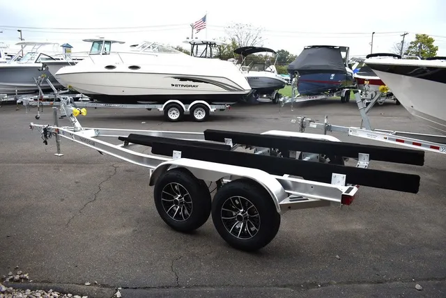 Slide: The Image of Yacht Club Trailers 21-6000 Aluminum tandem axle bunk boat trailer 2026 - 1