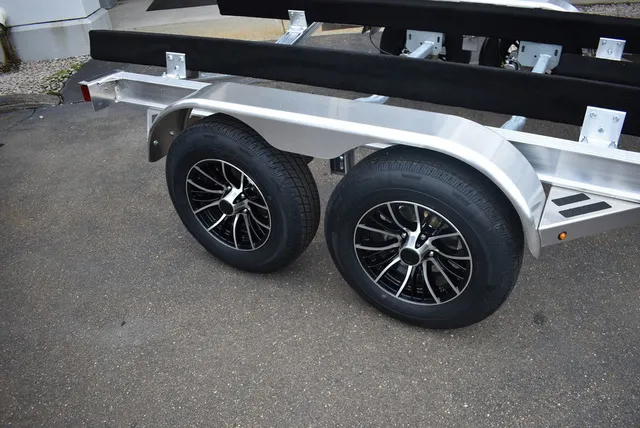 Slide: The Image of Yacht Club Trailers 21-6000 Aluminum tandem axle bunk boat trailer 2026 - 6