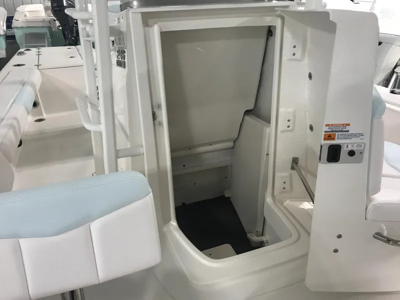 Slide: The Image of 2024 Robalo 246 Cayman Sky Deck interior storage compartment. - 11
