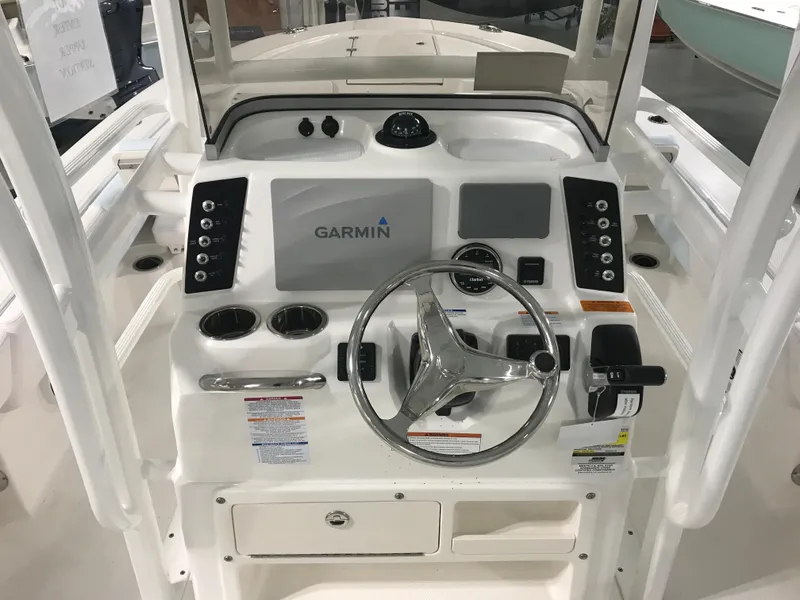 Slide: The Image of 2024 Robalo 246 Cayman Sky Deck boat console with Garmin navigation system. - 6