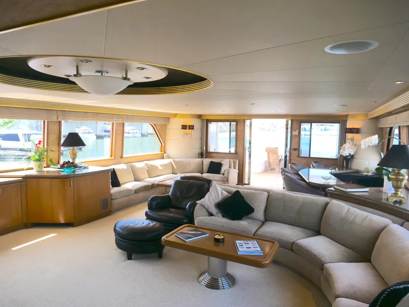 Slide: The Image of Luxurious interior of 2000 Westport 112 yacht with elegant seating and large windows. - 14